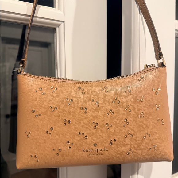 kate spade Handbags - Kate Spade Tan Clutch with Gold Embellishments